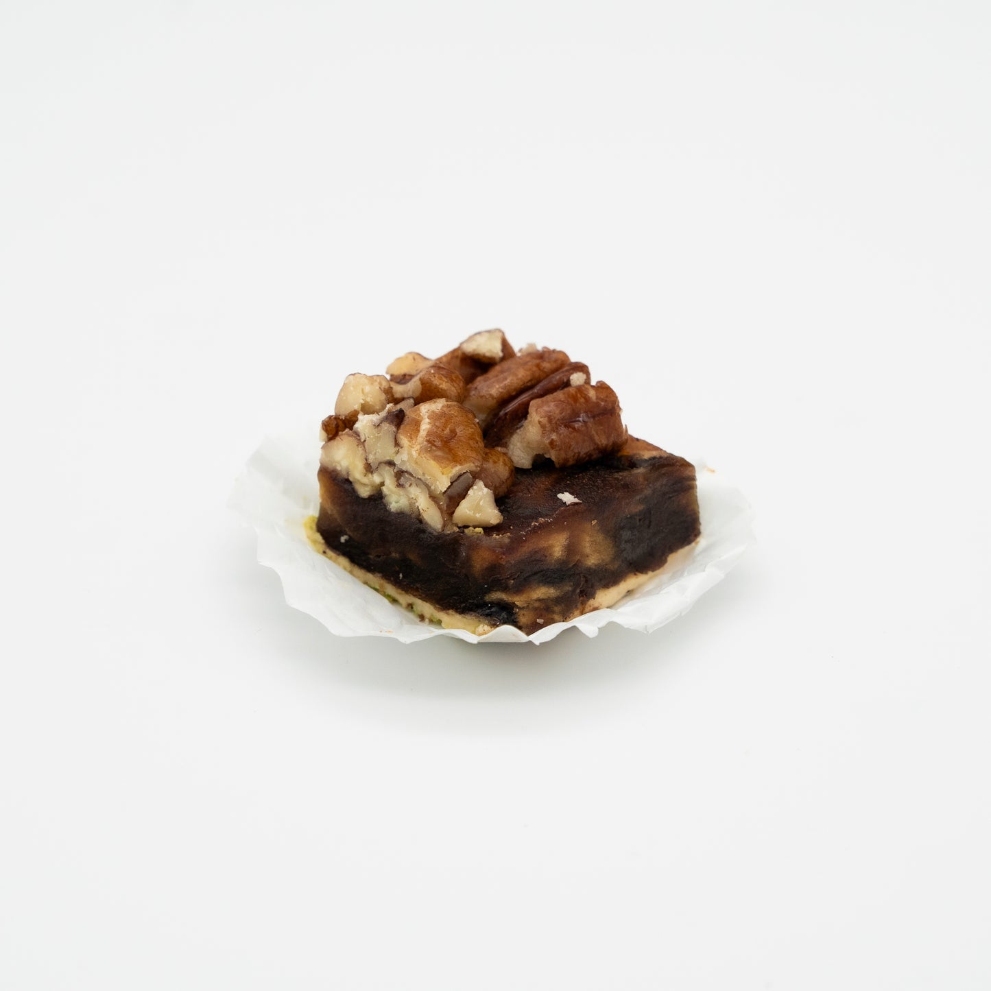 Walnut crushed filled with chocolate and date paste 