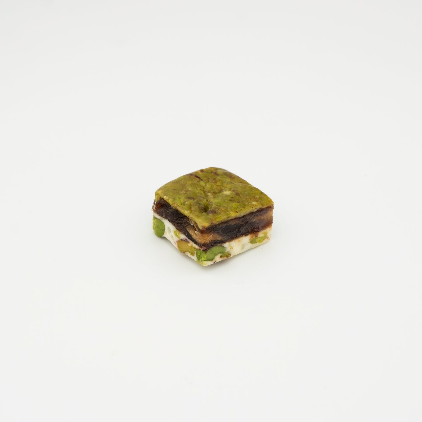 Powdered pistachio date paste and Halva with pistachio filling 